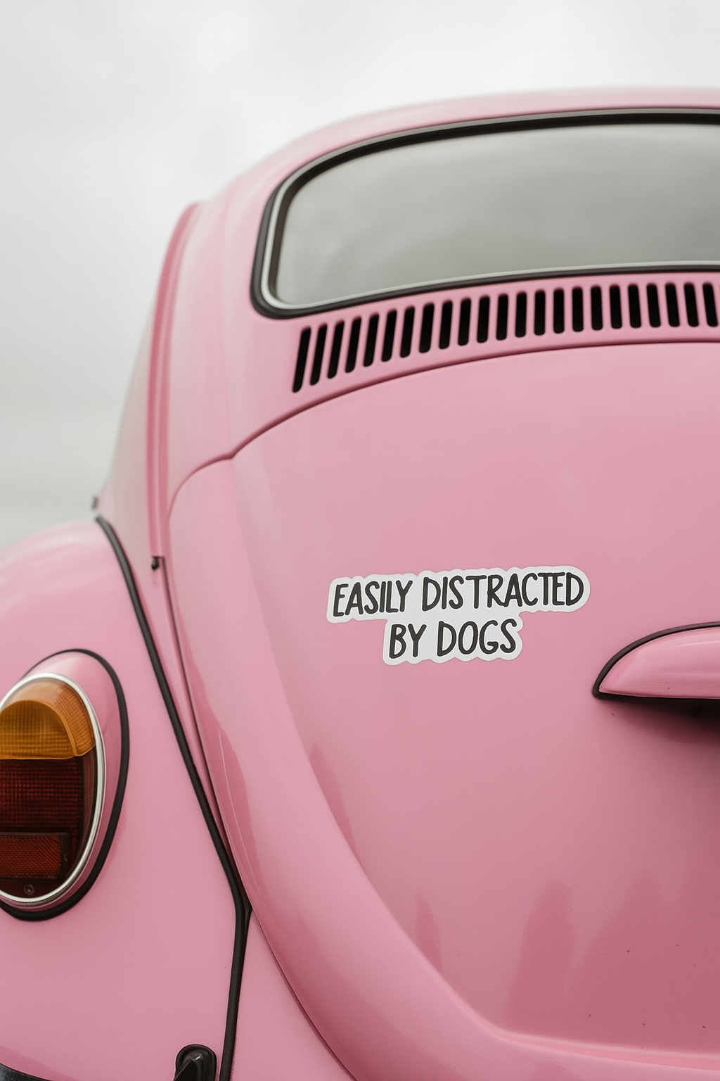 "EASILY DISTRACTED BY DOGS" STICKER